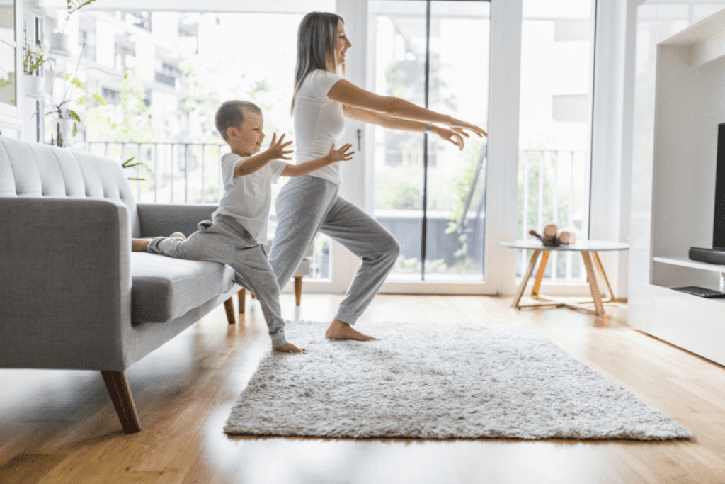 Busy midlife mom exercising with child